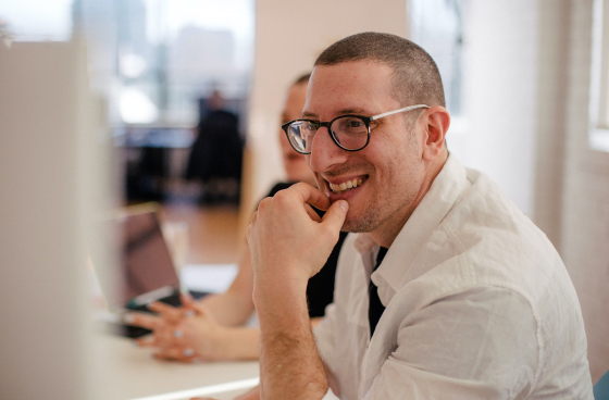 man-smiling-working-at-computer