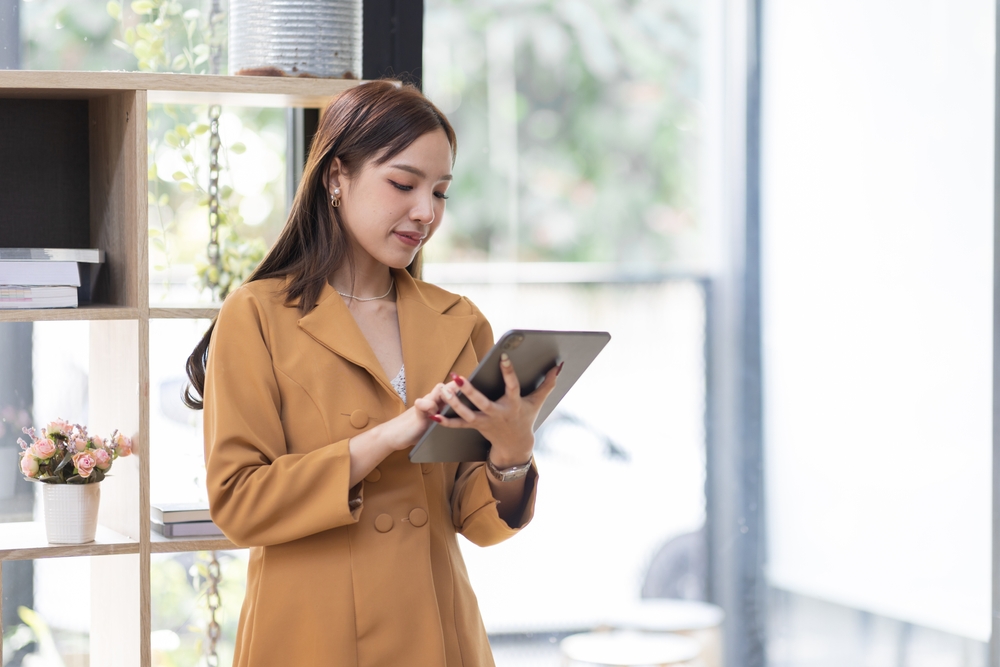 businesswoman with ipad_shutterstock_2238144815