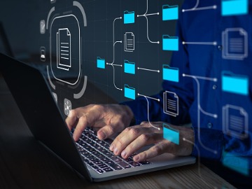 document-management-system-being-setup-by-it-consultant-working-on-picture-id1291478674